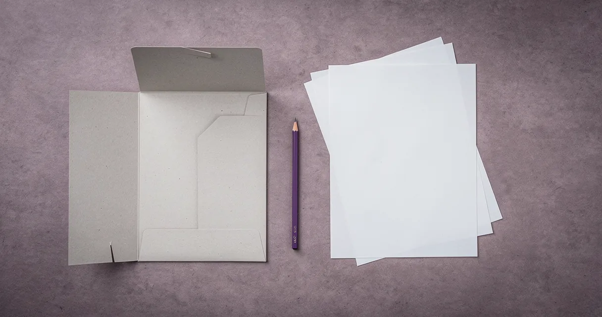 A plain folder with loose papers and a violet pencil on a putty desk